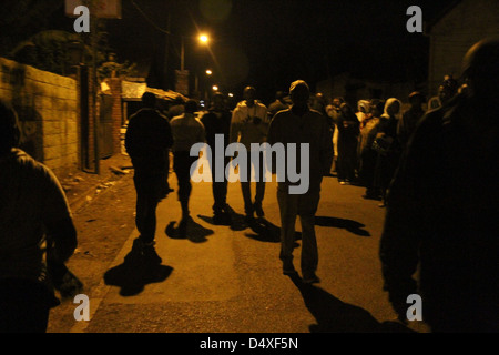 New Kihumbuini Primary School, Nairobi, Kenya - 4 March 2013: Kangemi resident were out on the street as early as 3 am to join voting ques. The centre was eventually opened officially at 6.12 am. © David Mbiyu/Alamy Live News Stock Photo