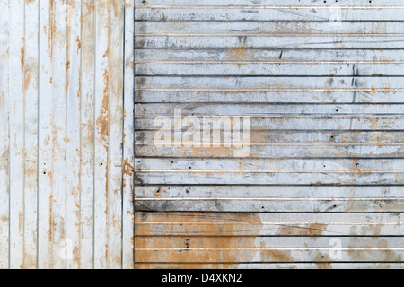 Old rusted corrugated galvanized metal wall background texture Stock Photo