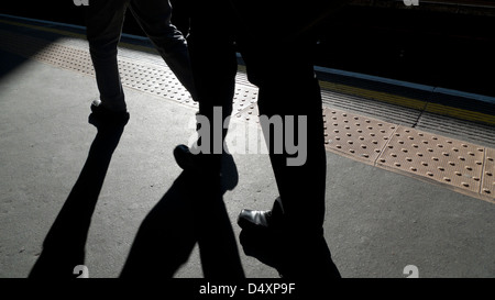 Commuters walking along the platform at Barbican underground station London England UK  KATHY DEWITT Stock Photo