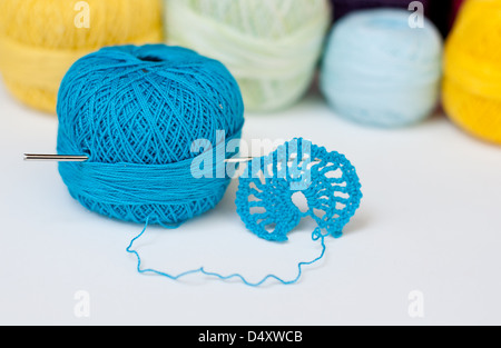 Crochet sample with colorful yarn in the background Stock Photo
