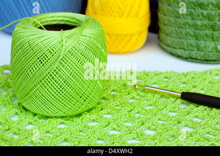 Green crochet sample with yarn and hook Stock Photo