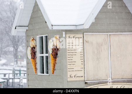 Snow on an ice cream kiosk in Ambleside, Lake District, UK. Stock Photo