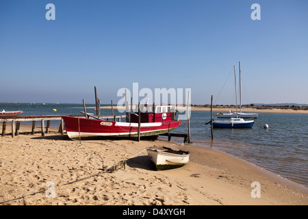 Boats pulled up on the beach at the Mimbeau at Cap Ferret in the Gironde region of France. Stock Photo