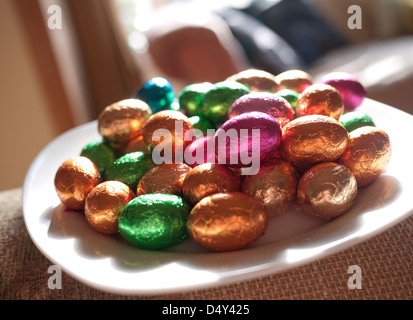 colourful easter eggs on plate Stock Photo