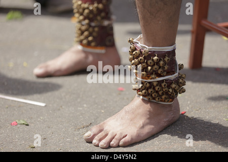 Hindu devotee feet with bells in annual Thaipusam religious festival in Batu Caves, near Kuala Lumpur, Malaysia. Stock Photo