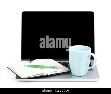 Tea cup and office supplies on laptop. Isolated on white background Stock Photo