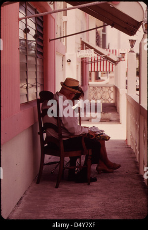 A residential hotel in the South Beach area of Miami Beach provides affordable housing for elderly individuals on small incomes. The front porch is a popular spot for relaxation. This photo was part of the DOCUMERICA project documenting life for seniors in the 1970s. Stock Photo