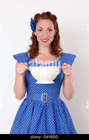 Woman holding a colander bowl Stock Photo