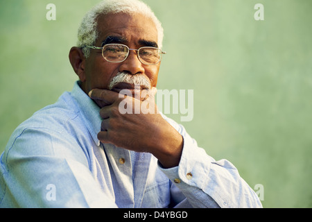 Black people and emotions, portrait of depressed senior man with glasses looking at camera. Copy space Stock Photo