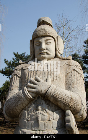 China, Beijing. Changling Sacred Way. 14th century Ming Dynasty warrior statue in traditional costume. Stock Photo