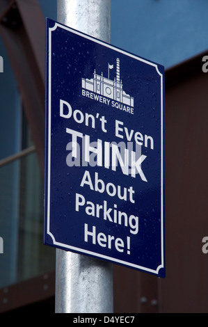 “Don’t even think about parking here!”. A quirky humorous No Parking sign at Brewery Square in Dorchester, Dorset, England, United Kingdom. Stock Photo