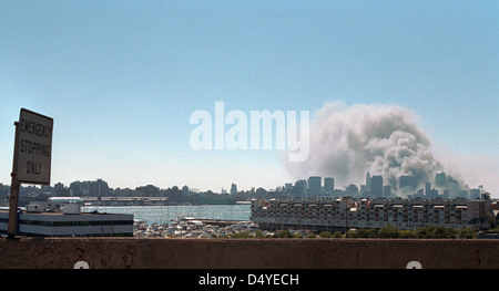 Smoke rises from the site of the World Trade Center Tuesday, Sept. 11, 2001. Photo by Paul Morse, Courtesy of the George W. Bush Presidential Library Stock Photo