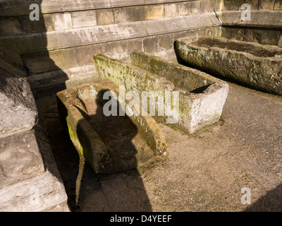 Shadows on Stone carved coffins near Ripon Cathedral North Yorkshire England Stock Photo