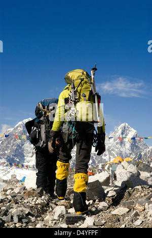 Nepal, Mount Everest. Climbers return to base camp after spending a day navigating the Khumbu Icefall. Stock Photo