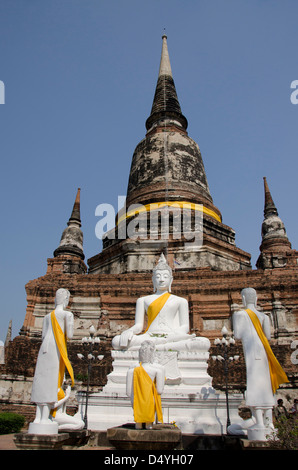 Thailand, Ayutthaya. Wat Phra Chao Phya-thai. Traditional Thai bell-shaped temple aka Chedi or Stupa with Buddha statues. UNESCO Stock Photo