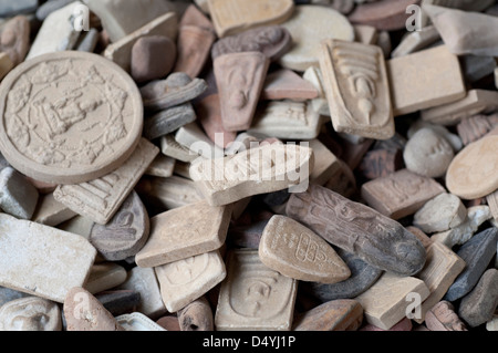 Thailand, Bangkok Amulet Market. Detail of clay amulets, worn to avoid misfortune. Stock Photo