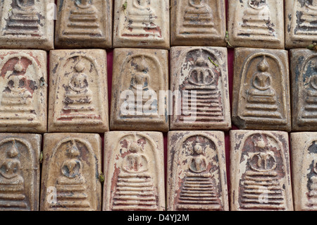 Thailand, Bangkok Amulet Market. Detail of clay amulets, worn to avoid misfortune. Stock Photo