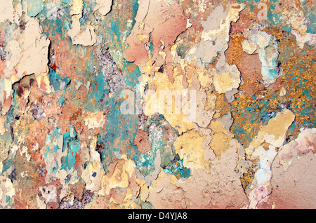 Layers of peeling, chipped paint and plaster on a wall in Oaxaca, Mexico. Stock Photo