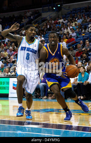 New Orleans Hornets' guard J.R. Smith (#23) looks to drive