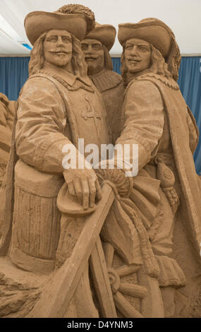 Binz, Germany. 20 March 2013. A sand sculpture inspired by the novel 'The three Musketeers' is on display at the sand sculpture festival in Binz, Germany, 20 March 2013. Around 50 artists from Russia, USA, Latvia and Poland are forming their sculptures from 12,000 of special sand. The show will take place in a tent from 23 March till the beginning of November 2013. Photo: STEFAN SAUER/DPA/Alamy Live News Stock Photo