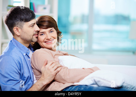 Portrait of middle aged couple having rest at home Stock Photo