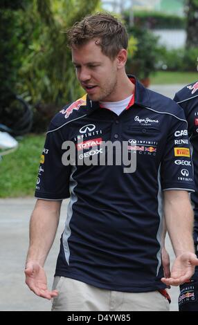 Sepang, Malaysia. March 21, 2013.   Red Bull Racing Renault Formula One driver Sebastian Vettel of German walking through paddock area in the Sepang International Circuit on Formula One 2013 Malaysian Grand Prix. Credit: Robertus Pudyanto/Aflo/Alamy Live News Stock Photo