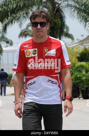 Sepang, Malaysia. March 21, 2013.   Scuderia Ferrari Formula One driver Fernando Alonso of Spanish walking through paddock area in the Sepang International Circuit on Formula One 2013 Malaysian Grand Prix. Credit: Robertus Pudyanto/Aflo/Alamy Live News Stock Photo