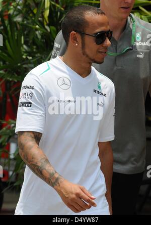 Sepang, Malaysia. March 21, 2013.   Mercedes AMG Petronas Formula One driver Lewis Hamilton of British walking through paddock area in the Sepang International Circuit on Formula One 2013 Malaysian Grand Prix. Credit: Robertus Pudyanto/Aflo/Alamy Live News Stock Photo