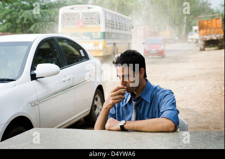 Businessman drinking tea Stock Photo
