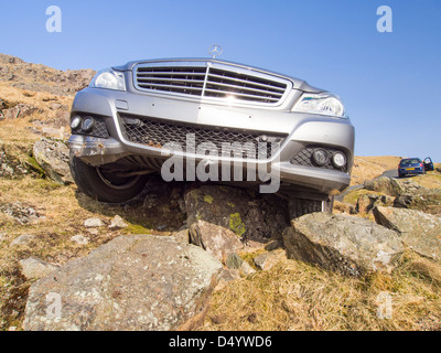 A car crashed on Hardknott Pass one of the steepest roads in the UK, Lake District. Stock Photo