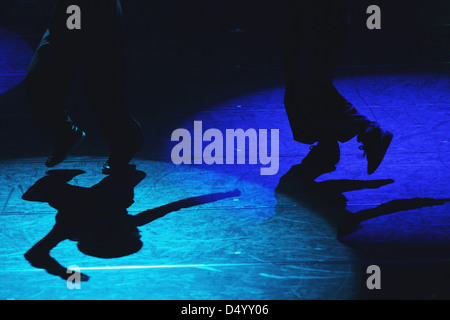 Shadows of dancers on the floor Stock Photo