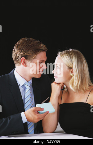 Man giving a gift to his girlfriend Stock Photo