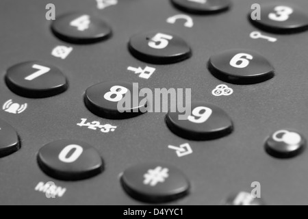 full frame closeup of a dark grey phone keypad Stock Photo