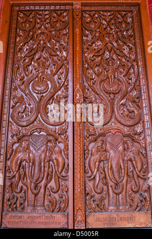 Ornament wooden door of Thai temple in Chiangmai, Thailand Stock Photo