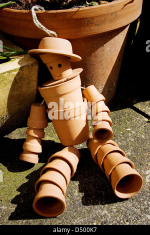 Terracotta flower pot man Stock Photo