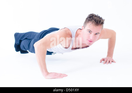 Sportive man doing push up isolated on white Stock Photo