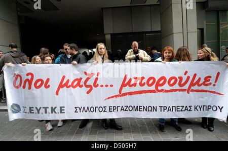 Athens, Greece. 21st March 2013. Employees of Cyprus based banks hold a protest banner saying “together we can” outside the Greek Finance Ministry in Athens. Credit: Giorgos Nikolaidis/Alamy Live News Stock Photo