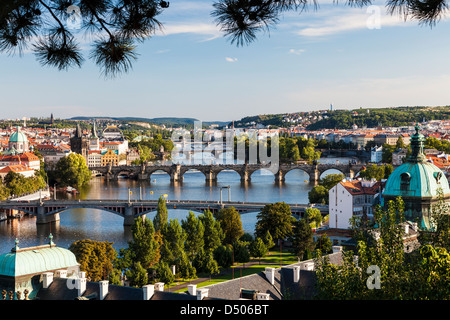 View of Prague and bridges over river Vltava (Moldau) Czech Republic. Famous Charles Bridge is second from bottom. Stock Photo