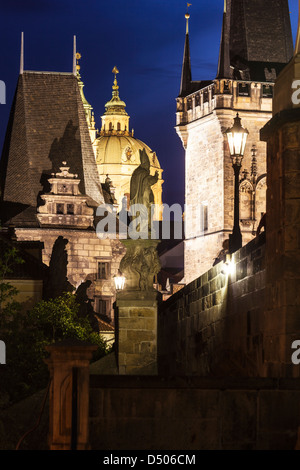Unusual viewpoint from the side of Charles Bridge, Karlův most, towards the Lesser Town Quarter (Malá Strana) at twilight Stock Photo