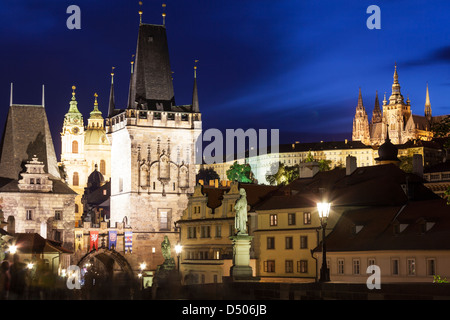 Twilight on Charles Bridge towards Prague Castle and St Vitus Cathedral above the Lesser Town Quarter (Malá Strana). Stock Photo