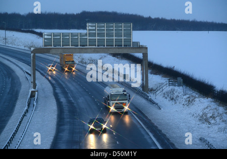 traffic struggling through blizzard winter conditions on a1/ m motorway near leeds yorkshire uk Stock Photo