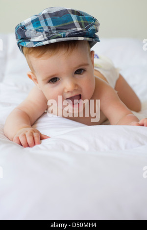 Portrait of cute baby boy wearing blue hat Stock Photo - Alamy