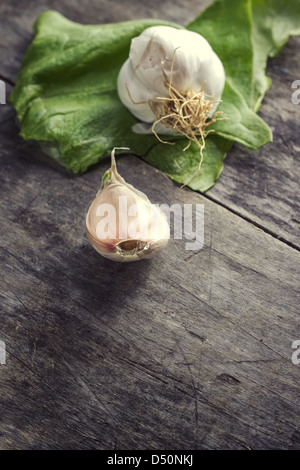 Garlic bulbs and cloves on table, closeup. Stock Photo
