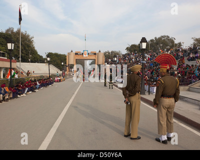 Smartly dressed soldiers and colorful crowds at the Wagah Border ceremony in Punjab India Stock Photo