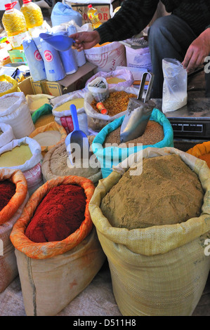 Spices being measuresd out in Jemaa D' Rehmat market  . South of Marrakech, Morocco Stock Photo