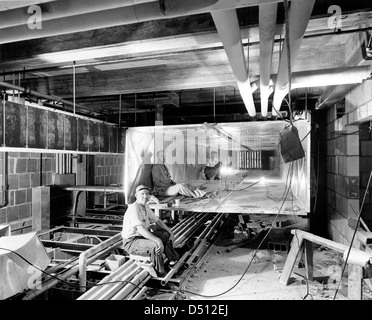 Workers inside Ductwork during the Renovation of the White House, 07/19/1951 Stock Photo