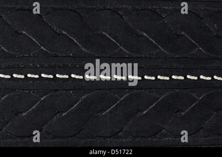 Closeup on a leather texture with a linear stitch. Stock Photo