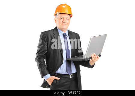 Experienced engineer posing with a laptop isolated on white background Stock Photo