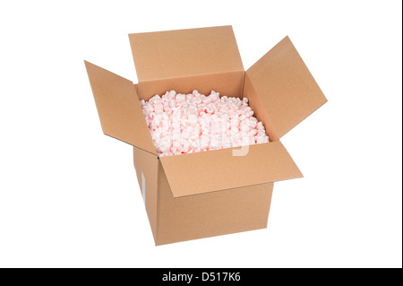 A new cardboard box full of pink protective packaging peanuts ready for shipping. Stock Photo