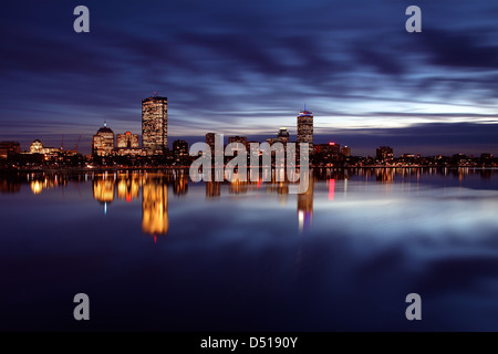 Boston's Back Bay skyline reflected in the Charles River with storm clouds Stock Photo